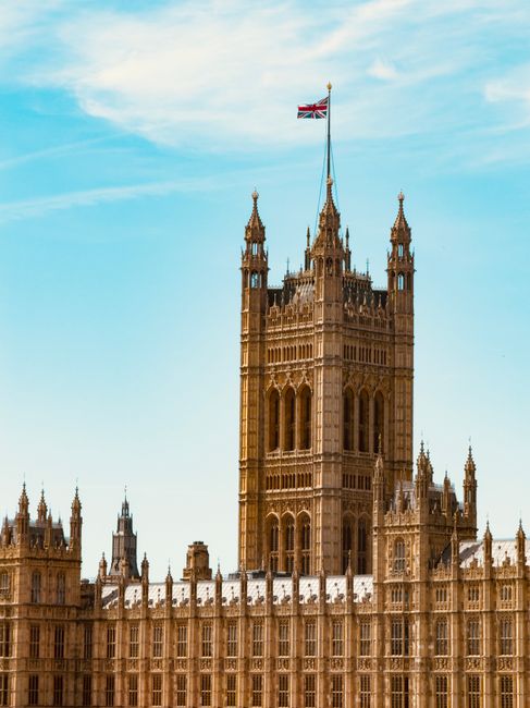 The image features the Elizabeth Tower, commonly known as Big Ben, situated at the north end of the Palace of Westminster in London. The tower is a Gothic Revival architectural structure constructed f